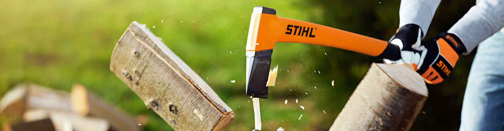 Stihl axe cutting logs